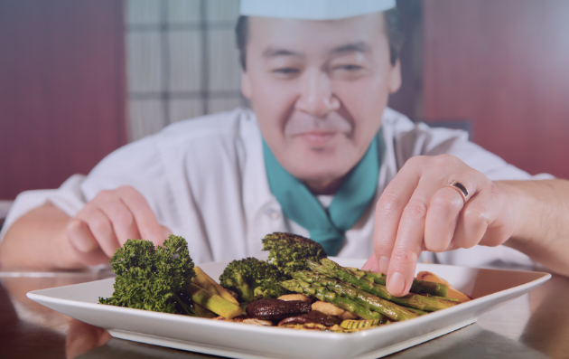 exploit the fortune inside, chef finalizing the plating