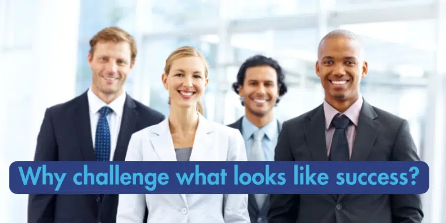 A diverse group of four smiling business professionals, with the question "Why challenge what looks like success?" overlaid in a blue box.