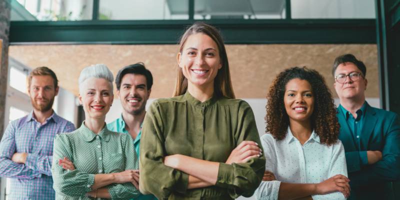 A business leader addressing a team, symbolizing how leadership decisions and behavior influence an organization’s risk culture.