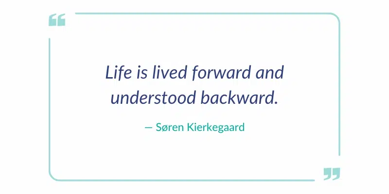 Digital quote card featuring Søren Kierkegaard's philosophy: "Life is lived forward and understood backward" inside a teal border.