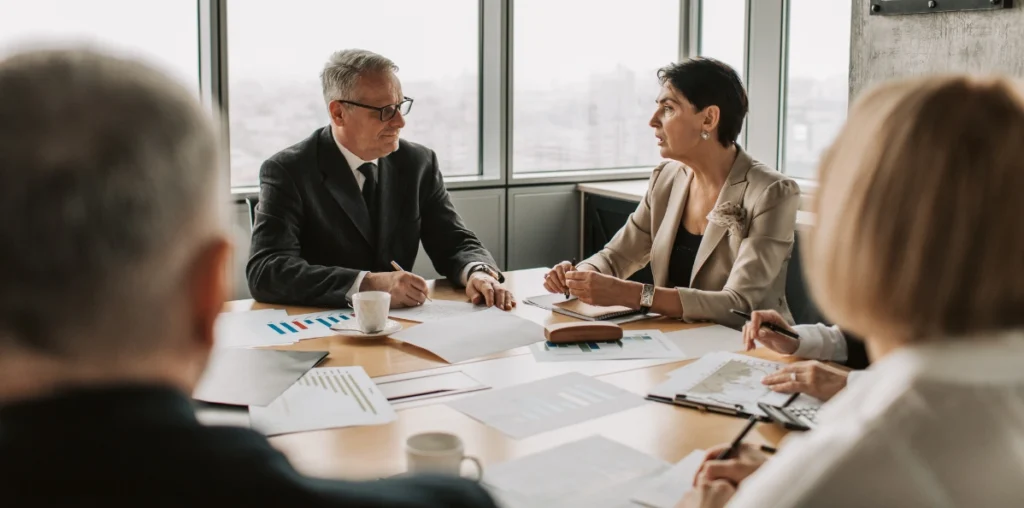 Two people sitting together in a meeting